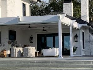 hurricane rated aluminum louvered pergola with screen, fan beam and corbel ends