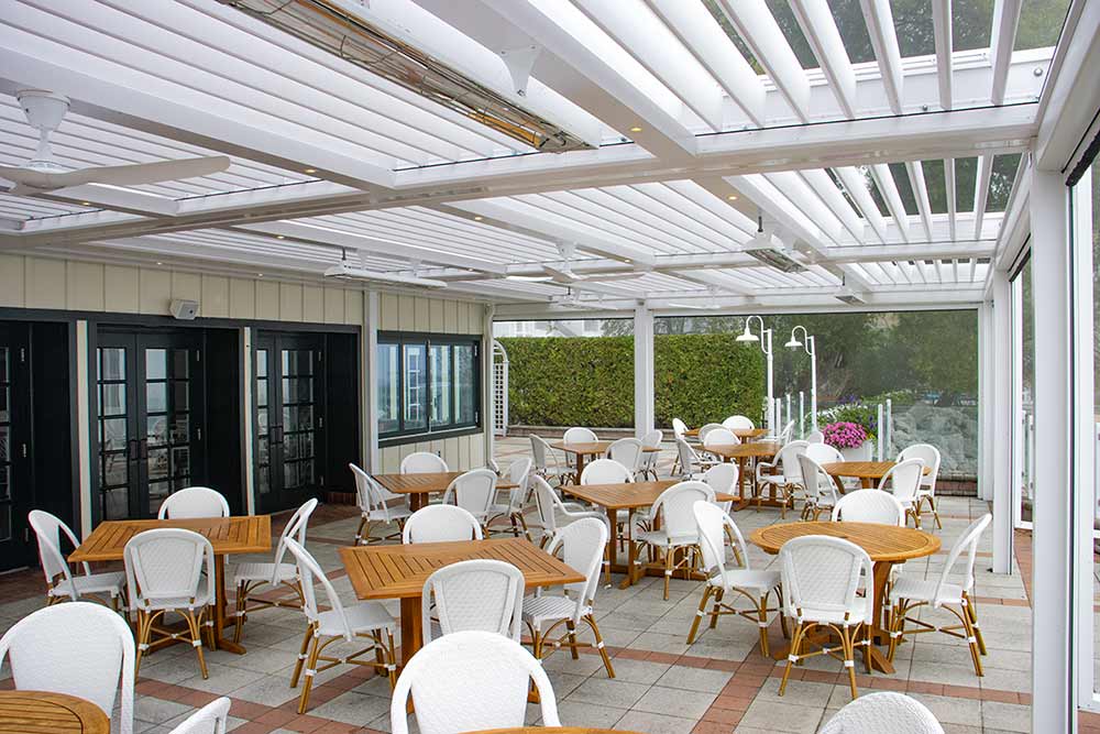 These motorized screens glide smoothly into place, providing privacy, shade, and wind protection with minimal effort.