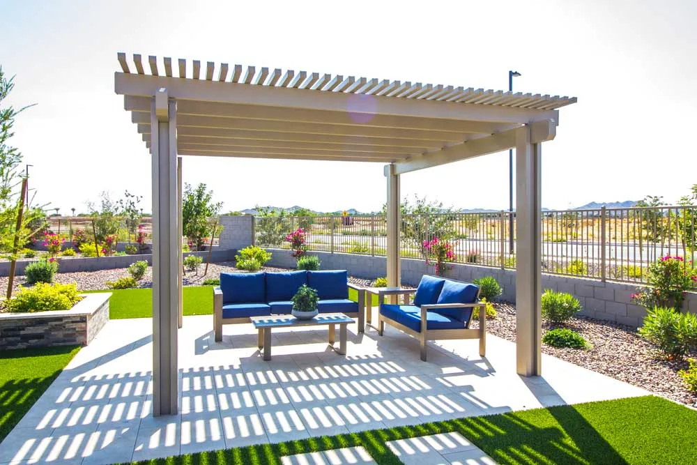 vinyl pergola outdoors with furniture beneath it