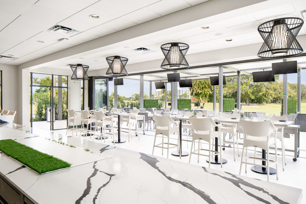 Outdoor space at Boca West - extented covered terrace with louvered pergola