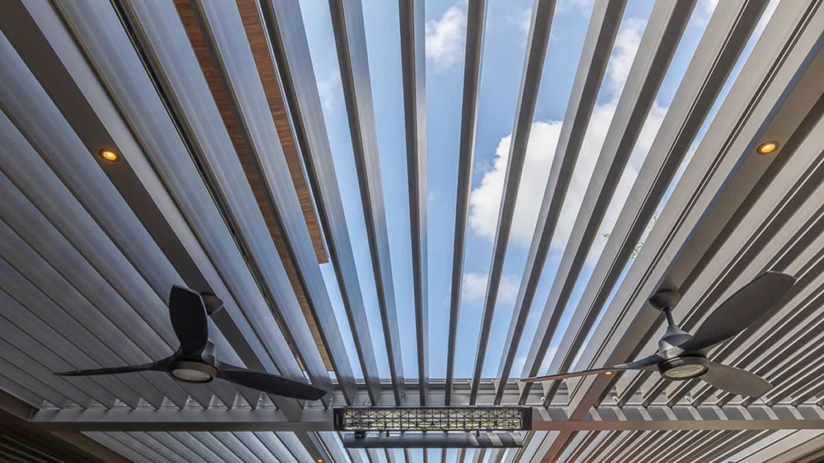 Motorized louvered roof with fans and heaters for dinner outside all year round