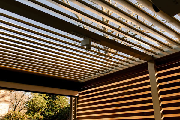 louvered walls and roof - aluminum pegola with wood graon finish- Azenco