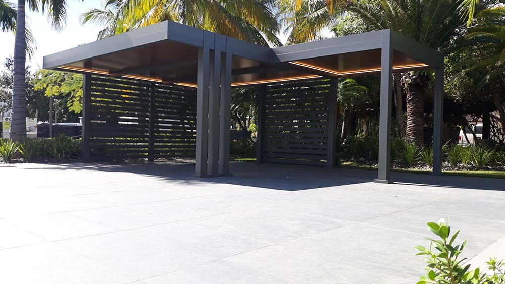 Modern Aluminum R-Car car port for luxury cars and golf carts - colors are bronze for the structure and wood grain finish for the insulated roof - Azenco