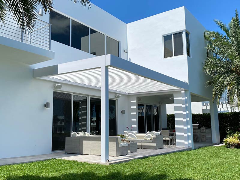 R-Blade louvered roof pergola set up on the corner of the house
