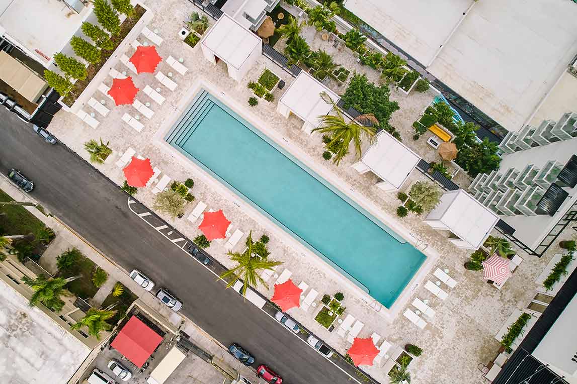 The Arlo Hotel in Miami features custom-built R-SHADE™ pergolas on its rooftop, providing guests with a luxurious and private poolside experience. These pergolas include privacy walls to ensure comfort and protection against Miami's intense weather conditions. The sleek design seamlessly integrates with the hotel’s aesthetic while offering an enhanced outdoor escape for visitors. Azenco Outdoor