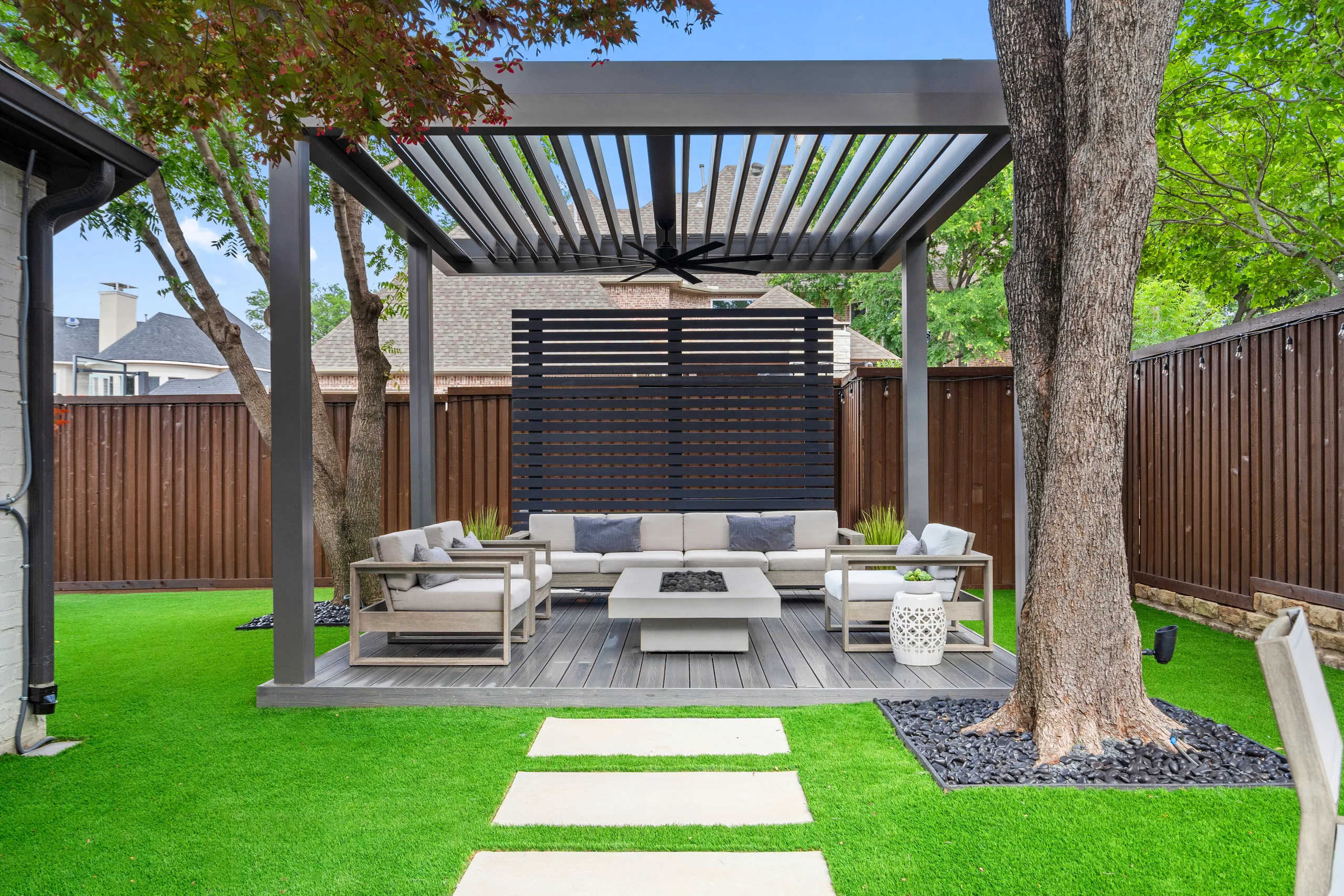 grey r-blade pergola on grass in backyard