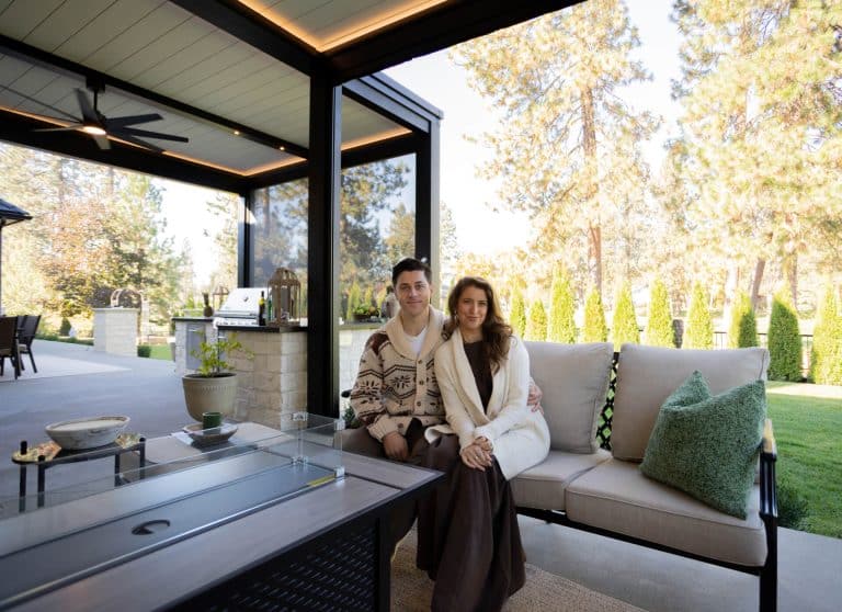 David Henrie and his wife under their R-BLADE™ motorized pergola in Idaho
