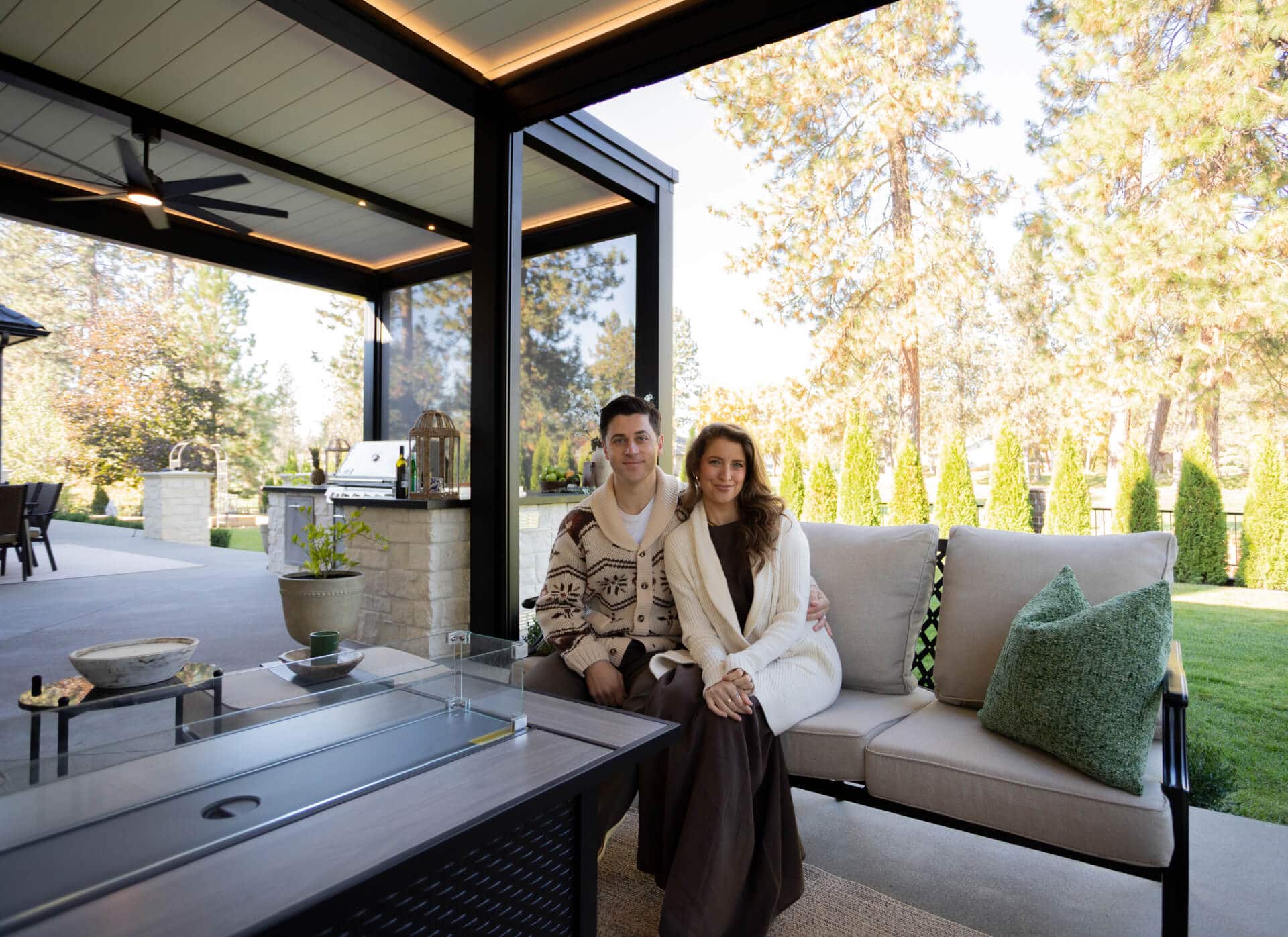 David Henrie and his wife under their R-BLADE™ motorized pergola in Idaho