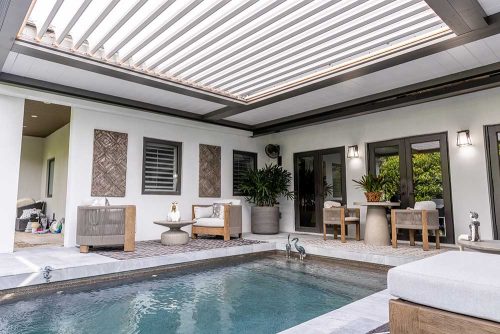 Pool deck covered with R-BLADE custom motorized louvered roof - Azenco Outdoor